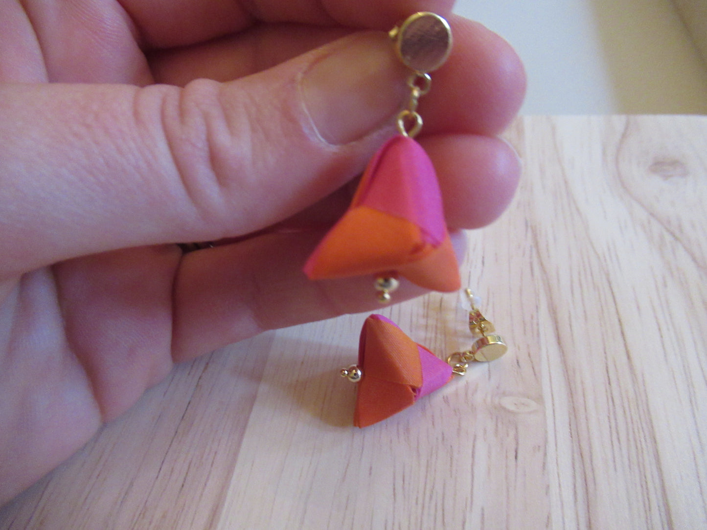 Handmade origami silk earrings in fuchsia pink and bright orange with small gold plated disc studs