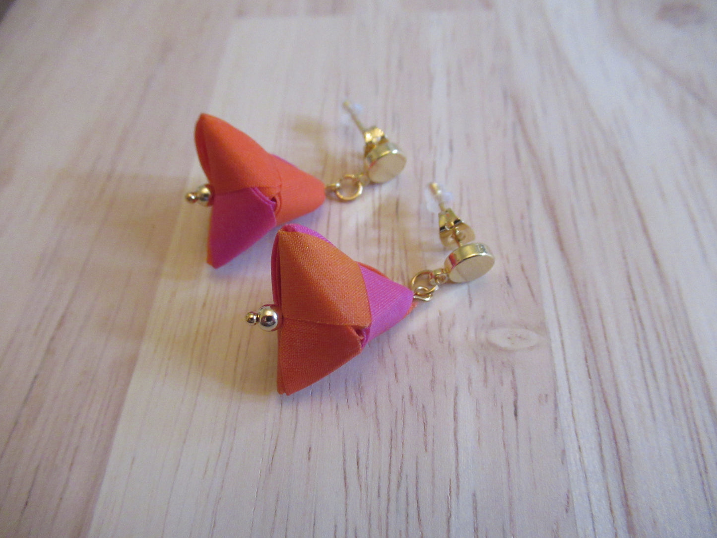 Handmade origami silk earrings in fuchsia pink and bright orange with small gold plated disc studs