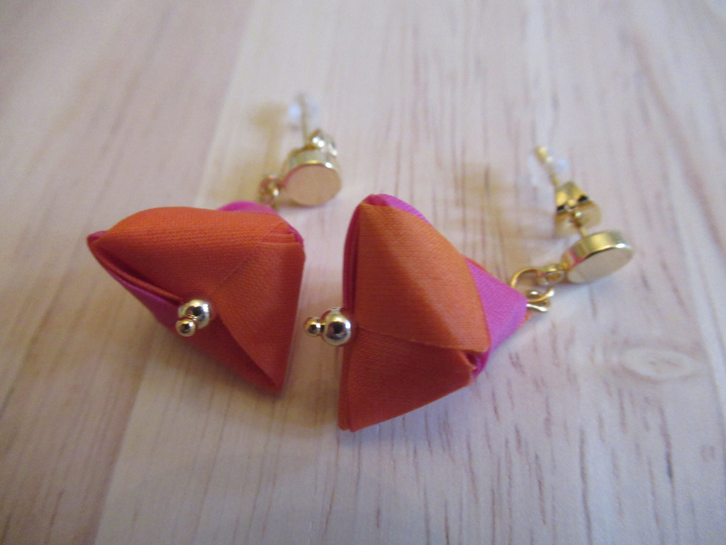 Handmade origami silk earrings in fuchsia pink and bright orange with small gold plated disc studs