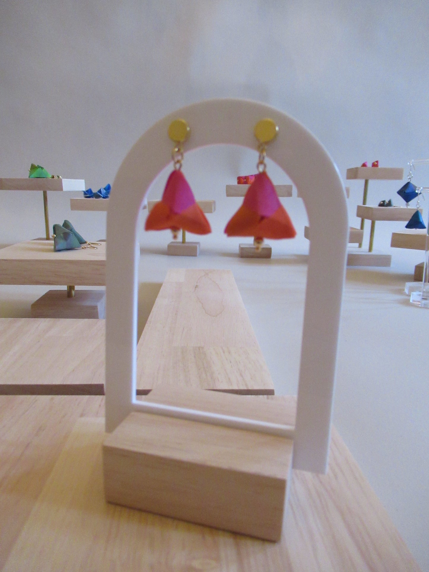 Handmade origami silk earrings in fuchsia pink and bright orange with small gold plated disc studs