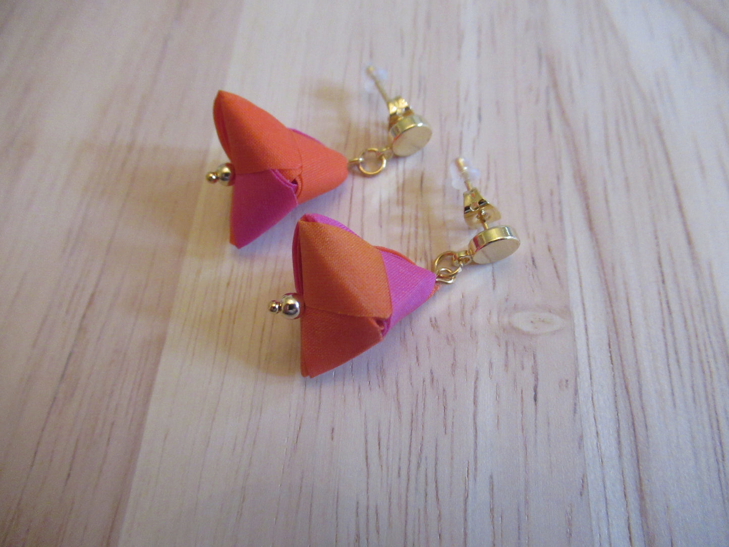 Handmade origami silk earrings in fuchsia pink and bright orange with small gold plated disc studs