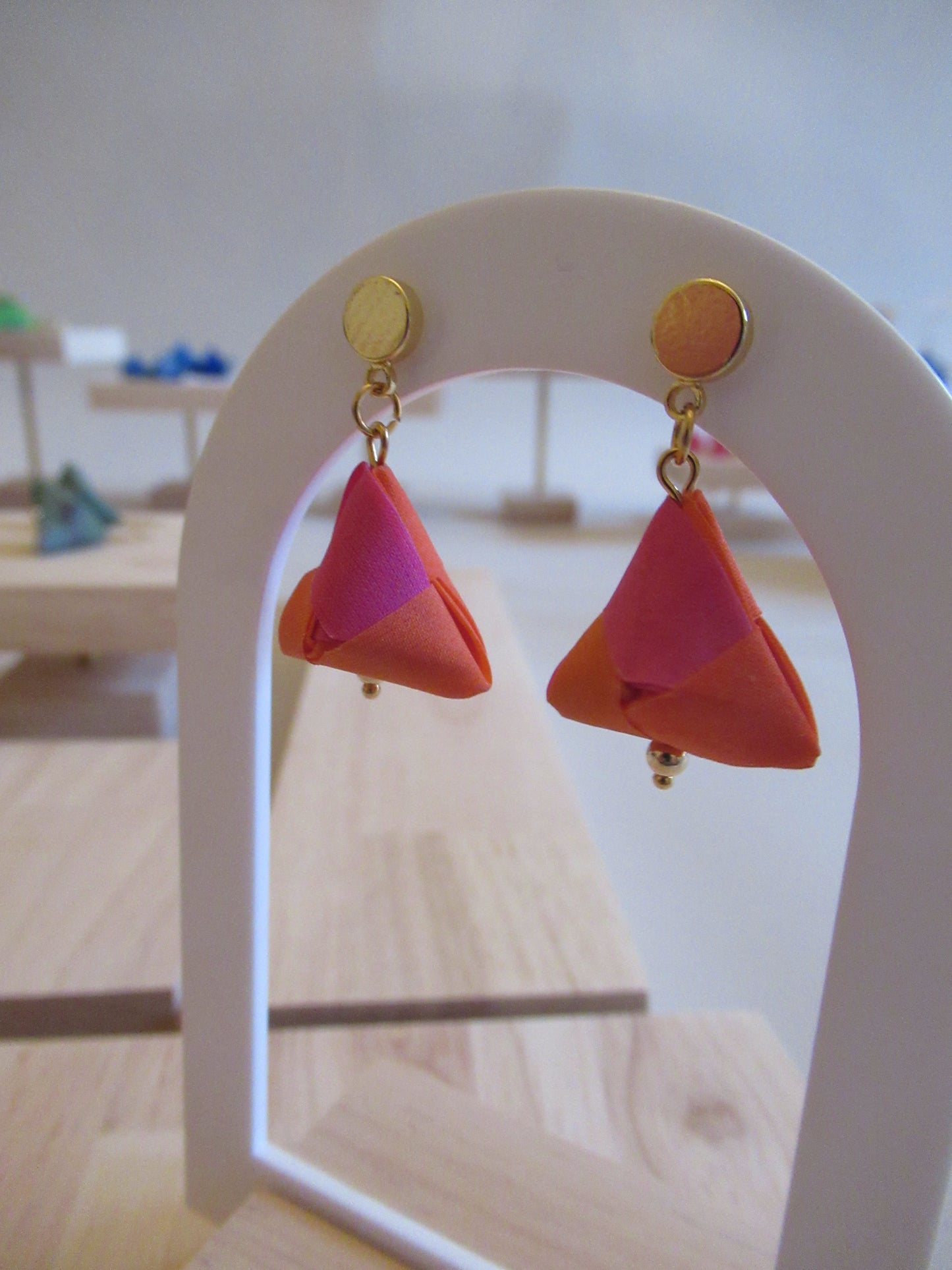 Handmade origami silk earrings in fuchsia pink and bright orange with small gold plated disc studs