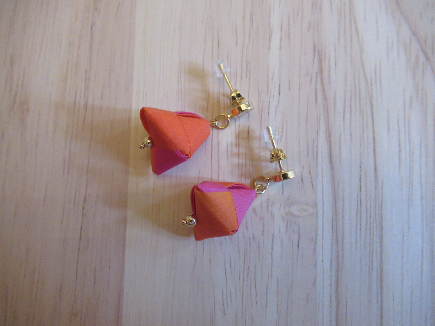 Handmade origami silk earrings in fuchsia pink and bright orange with small gold plated disc studs