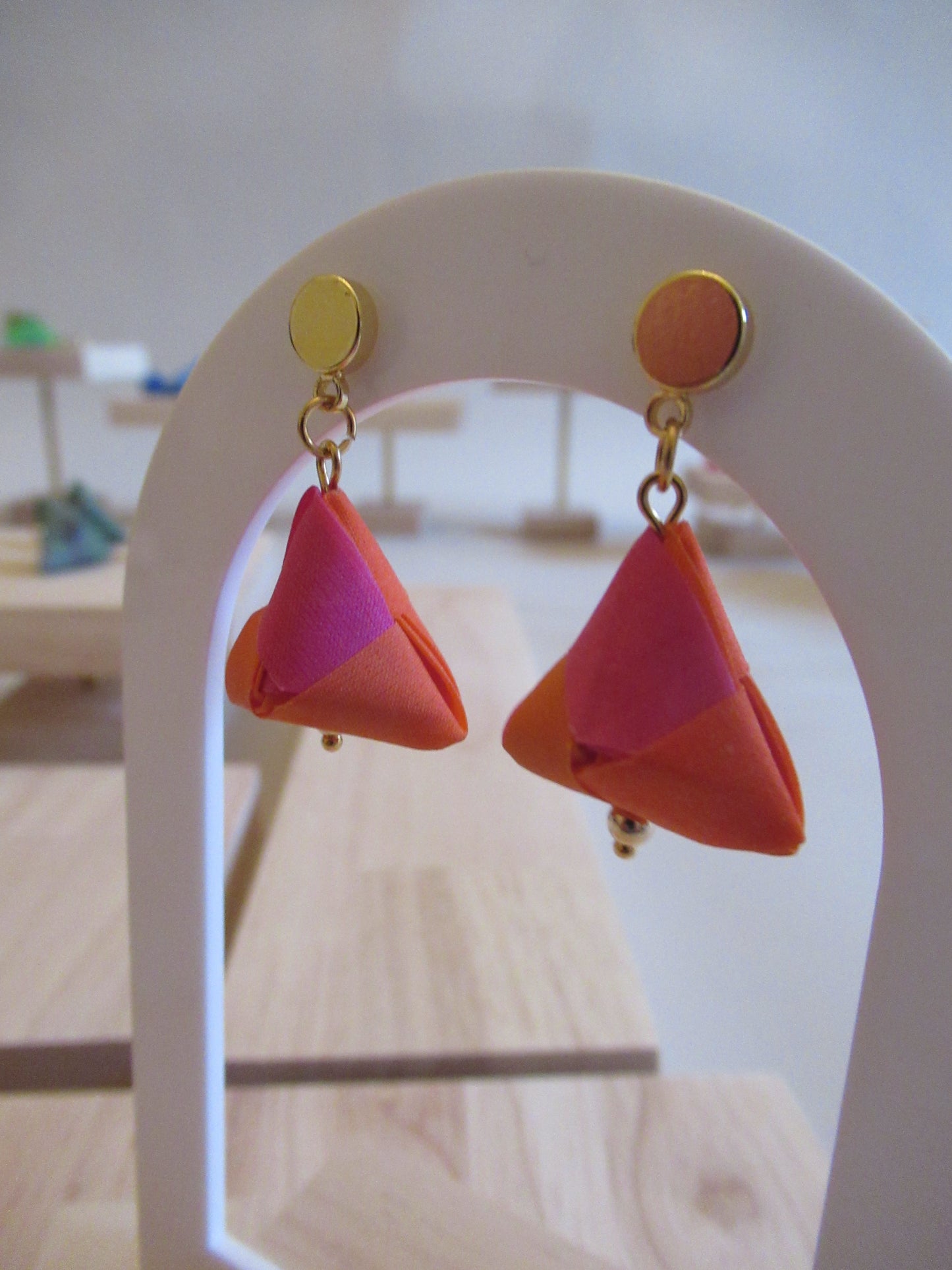 Handmade origami silk earrings in fuchsia pink and bright orange with small gold plated disc studs